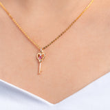 750/18k Yellow Gold Pink Sapphire with Diamond Key Pendant